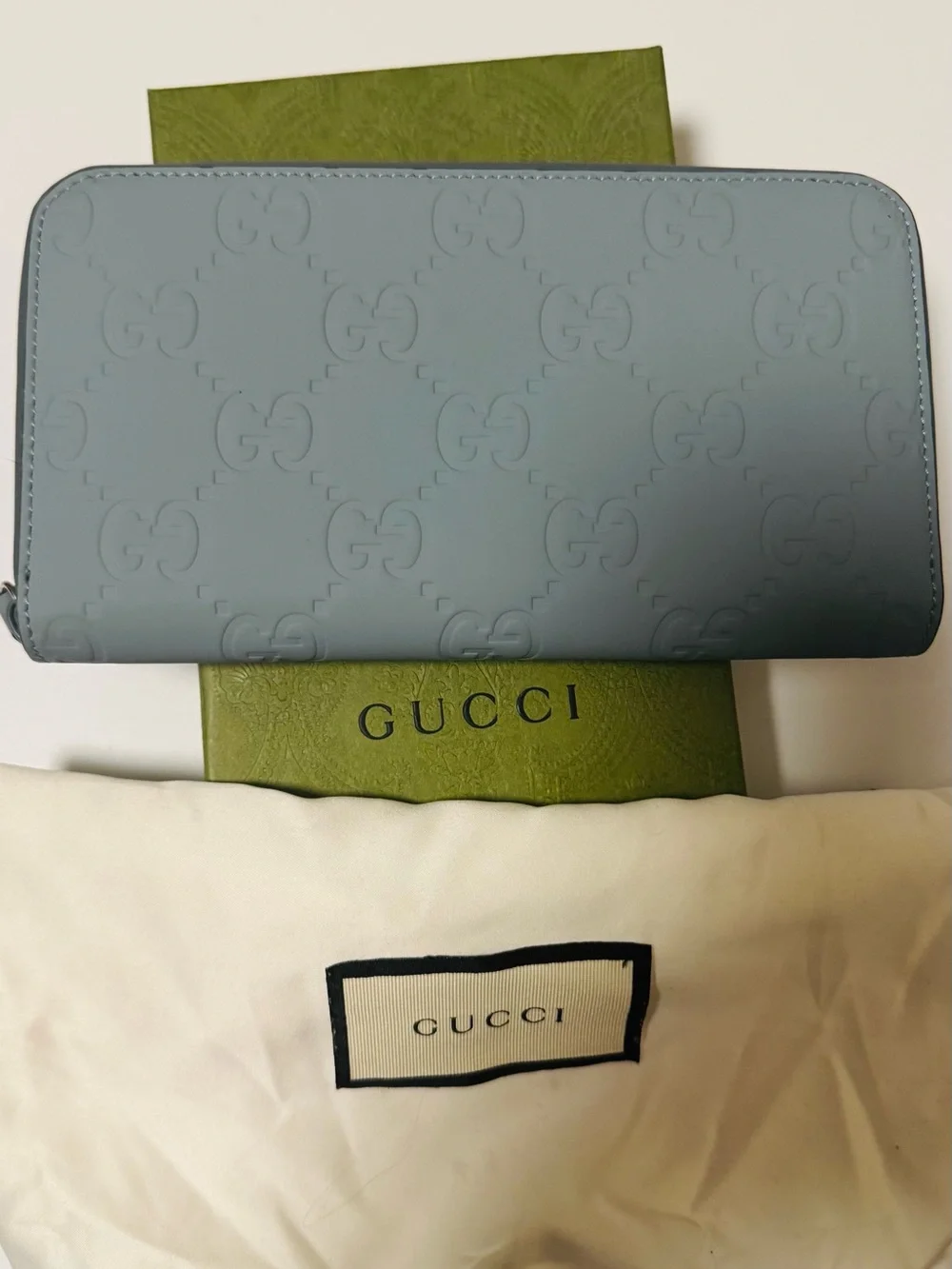 Gucci Light Blue Embossed GG Zip-Around Wallet